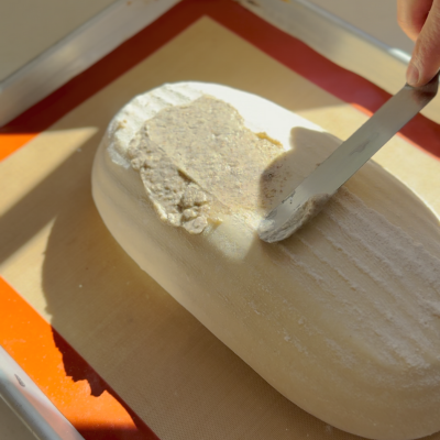 Spread tiger paste on loaf
