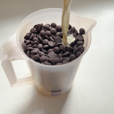 Pour cream over chocolate