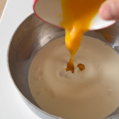 add egg yolks to cream